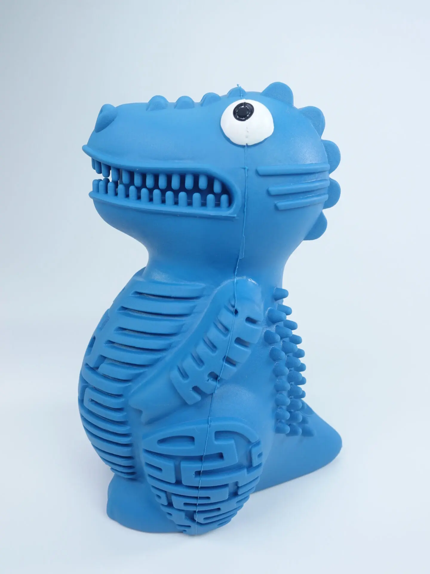 DinoTuff Rugged Dental Chew - The <strong>DinoTuff Rugged Dental Chew</strong> is an eco-friendly, durable natural rubber toy designed to promote your pet’s dental health while providing entertainment. Its <strong>teething texture</strong> cleans teeth during play, with a recess for applying toothpaste, and it also doubles as a <strong>puzzle treat dispenser</strong> to engage your pet’s mind. Made from non-toxic, bite-resistant materials, it’s ideal for heavy chewers and supports sustainability. The chew toy helps reduce plaque, promotes healthy gums, and provides hours of fun, all while being easy to clean and customizable. - dinotuff-dent-01 DinoTuff Rugged Dental Chew - Image 2